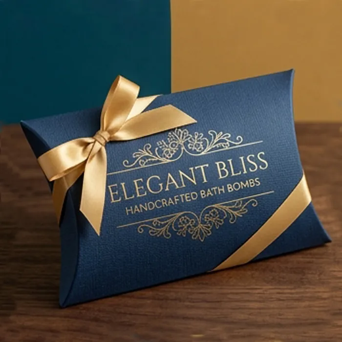 Navy bath bomb pillow box with gold lettering and a gold ribbon