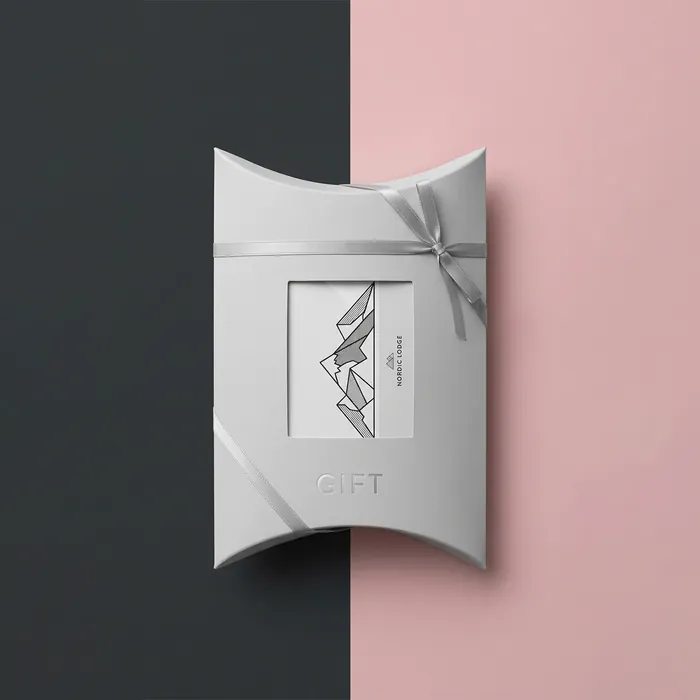 White gift card pillow box with a minimal illustrated panel