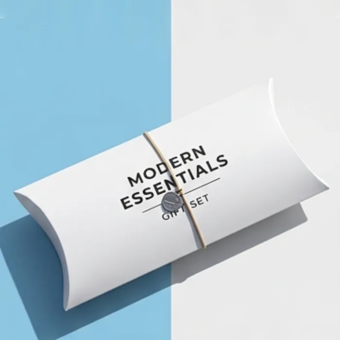 Long white pillow box with a modern essentials gift set wordmark