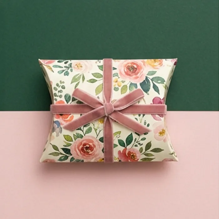 Small cream floral pillow box with a dusty pink ribbon