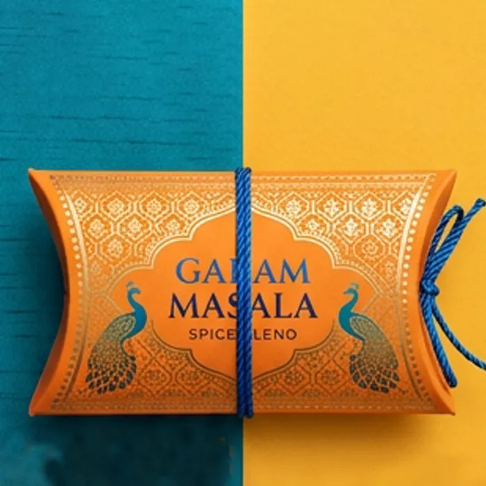Orange spice sachet pillow box with a garam masala print and a blue tie